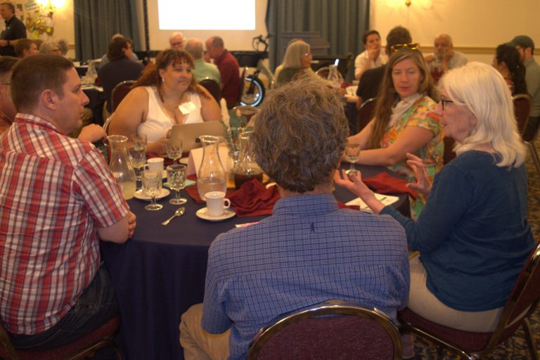 UV Energy Roundtable_DSC_0111 jpg Six people sitting around a round table sharing ideas.